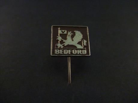 Bedford vrachtwagen donkerbruin-zilverkleurig logo